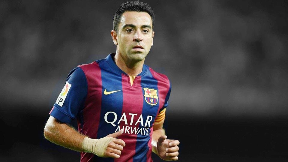 Xavi Hernandez sewaktu di Barcelona. - INDOSPORT